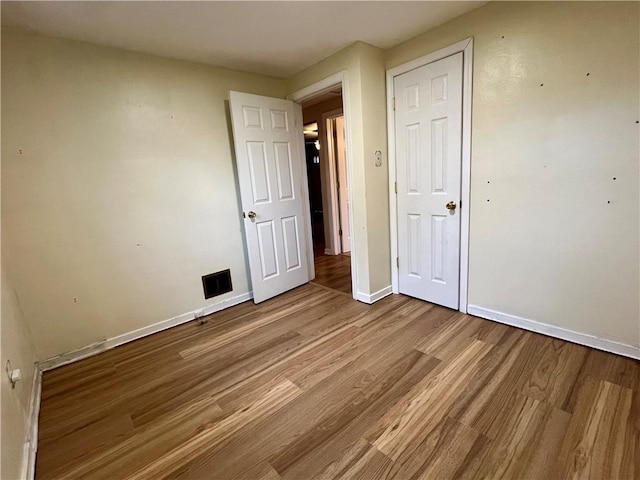 3329 Recker Dr, Baldwin Boro, PA 15227 - unfurnished bedroom with wood finished floors, baseboards, and a closet