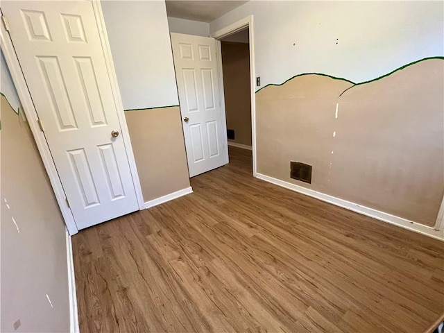 3329 Recker Dr, Baldwin Boro, PA 15227 - unfurnished bedroom with wood finished floors and baseboards