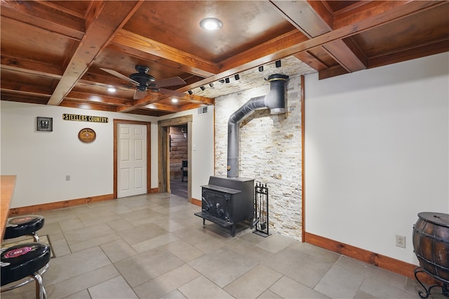 1125 Annisville Rd, Washington Twp But, PA 16050 - living room with a wood stove, baseboards, coffered ceiling, a ceiling fan, and wooden ceiling with exposed beams