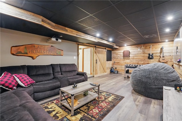 1125 Annisville Rd, Washington Twp But, PA 16050 - living area featuring a barn door, wood finished floors, wood walls, and a paneled ceiling