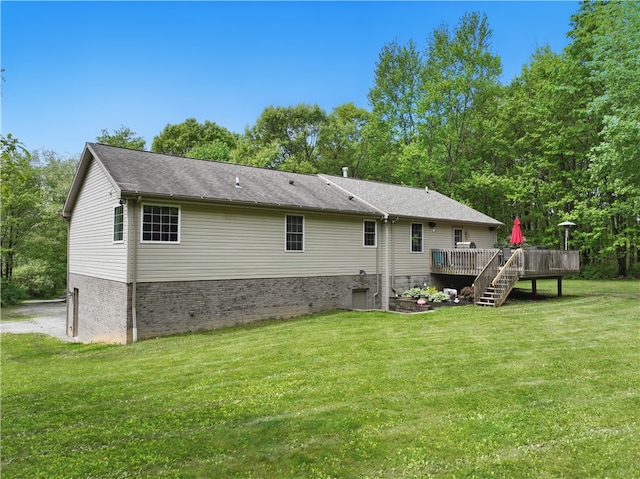 1125 Annisville Rd, Washington Twp But, PA 16050 - back of property featuring a deck, a yard, and brick siding