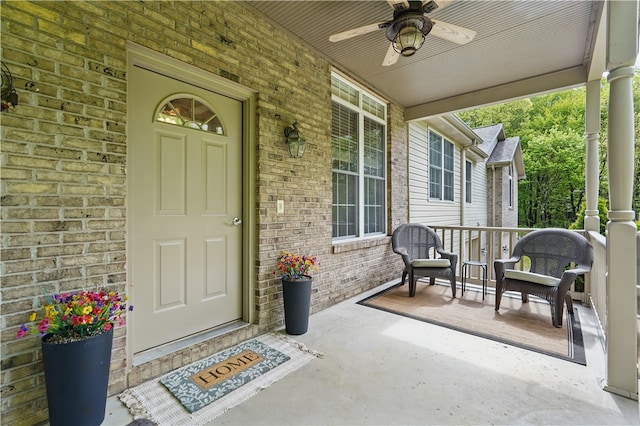 1125 Annisville Rd, Washington Twp But, PA 16050 - doorway to property with covered porch, brick siding, and ceiling fan