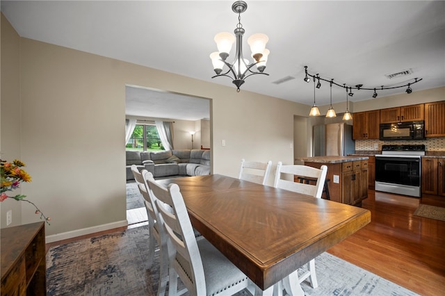 174 Hague Ln, South Union Twp, PA 15401 - dining space with dark wood-style flooring and a chandelier