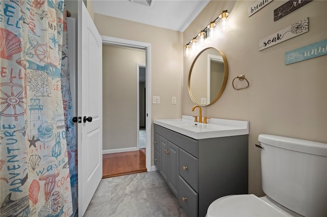 174 Hague Ln, South Union Twp, PA 15401 - full bathroom featuring vanity, toilet, baseboards, and marble look tiles
