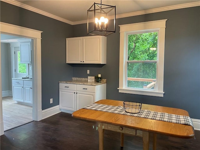 23 Columbia Park, Hempfield Twp Mer, PA 16125 - dining space with plenty of natural light, dark wood-style flooring, baseboards, and crown molding