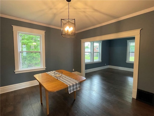 23 Columbia Park, Hempfield Twp Mer, PA 16125 - dining area with healthy amount of natural light, a chandelier, ornamental molding, and dark wood-style flooring