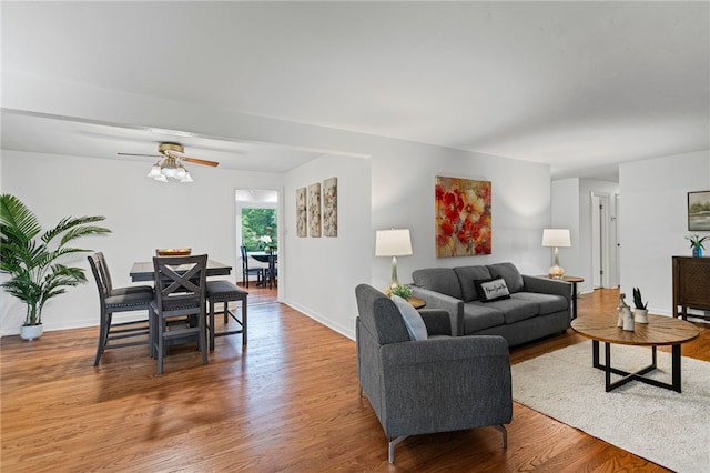 1527 W Ingomar Rd, Franklin Park, PA 15237 - living area with wood finished floors, a ceiling fan, and baseboards