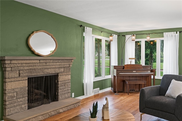 1527 W Ingomar Rd, Franklin Park, PA 15237 - living area featuring wood finished floors, a fireplace, and baseboards
