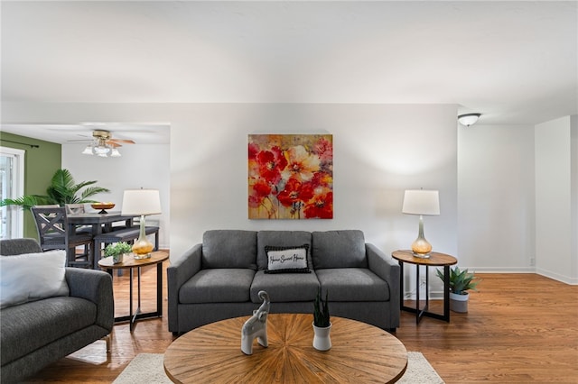 1527 W Ingomar Rd, Franklin Park, PA 15237 - living room featuring wood finished floors, a ceiling fan, and baseboards