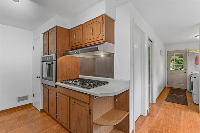 1527 W Ingomar Rd, Franklin Park, PA 15237 - kitchen featuring stainless steel appliances, under cabinet range hood, light wood-style floors, open shelves, and brown cabinetry