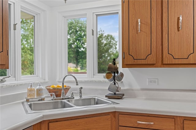 1527 W Ingomar Rd, Franklin Park, PA 15237 - kitchen featuring a sink, brown cabinets, and light countertops