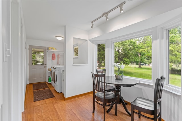 1527 W Ingomar Rd, Franklin Park, PA 15237 - dining room featuring washer and clothes dryer, healthy amount of natural light, and light wood finished floors