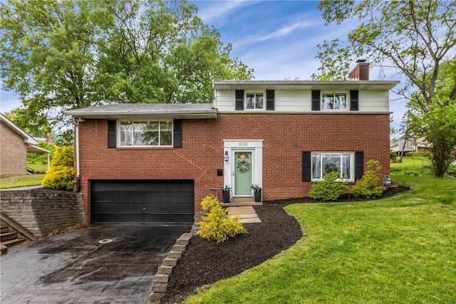 6032 Dalmation Dr, Bethel Park, PA 15102 - view of front of house with a chimney, an attached garage, asphalt driveway, brick siding, and a front lawn