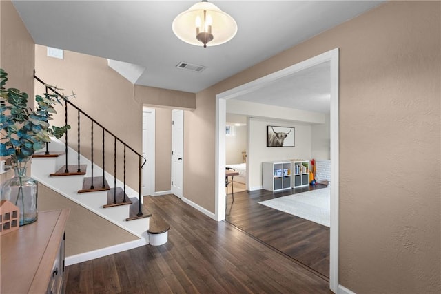 6032 Dalmation Dr, Bethel Park, PA 15102 - entrance foyer featuring wood finished floors, stairway, and baseboards