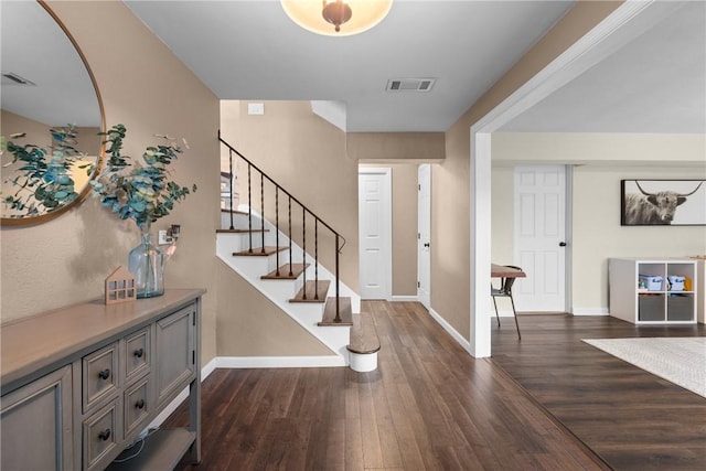 6032 Dalmation Dr, Bethel Park, PA 15102 - foyer entrance with dark wood-style floors, baseboards, and stairway