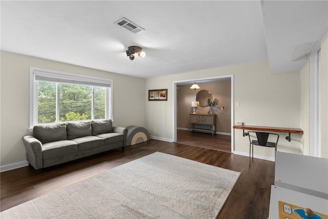 6032 Dalmation Dr, Bethel Park, PA 15102 - living area featuring dark wood-type flooring and baseboards