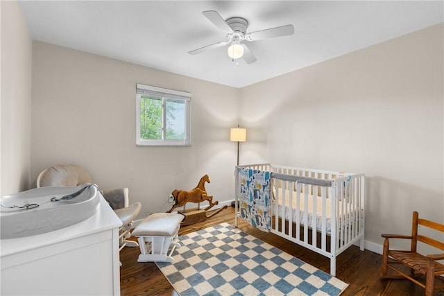 6032 Dalmation Dr, Bethel Park, PA 15102 - bedroom featuring wood finished floors, a crib, baseboards, and a ceiling fan