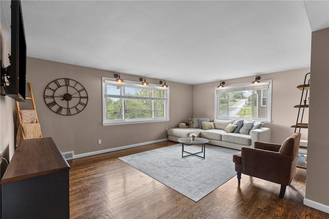 6032 Dalmation Dr, Bethel Park, PA 15102 - living area with dark wood-style floors and baseboards