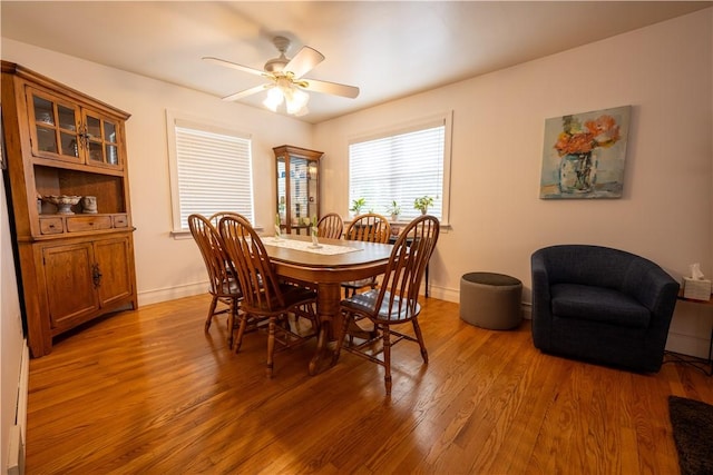 127 Burns Ave, Chippewa Twp, PA 15010 - dining space featuring light wood-style floors, a ceiling fan, and baseboards