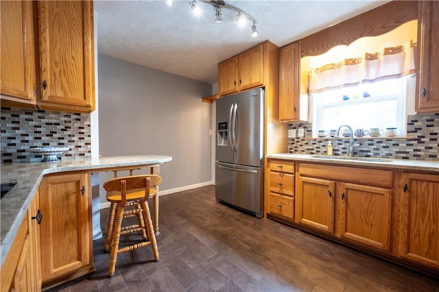 127 Burns Ave, Chippewa Twp, PA 15010 - kitchen with stainless steel fridge with ice dispenser, a sink, and decorative backsplash