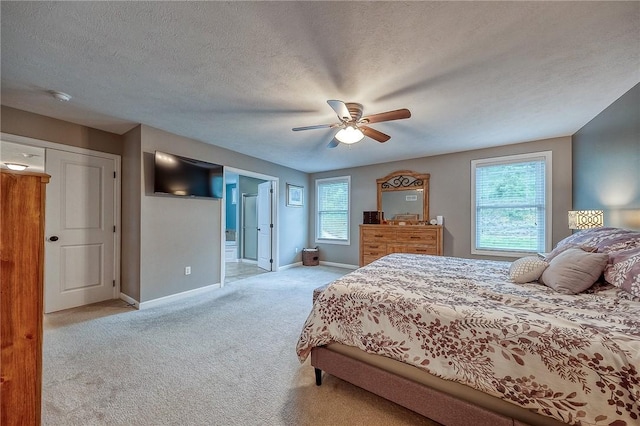 1517 Lombard Cir, South Strabane, PA 15301 - carpeted bedroom with baseboards, a ceiling fan, ensuite bath, and a textured ceiling