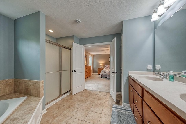 1517 Lombard Cir, South Strabane, PA 15301 - bathroom with a shower stall, a garden tub, connected bathroom, tile patterned floors, and double vanity