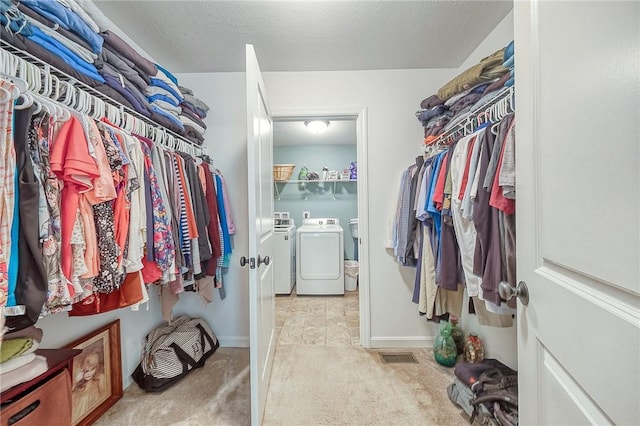 1517 Lombard Cir, South Strabane, PA 15301 - walk in closet featuring washing machine and clothes dryer and carpet flooring