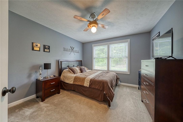 1517 Lombard Cir, South Strabane, PA 15301 - bedroom featuring baseboards, light carpet, a textured ceiling, and a ceiling fan
