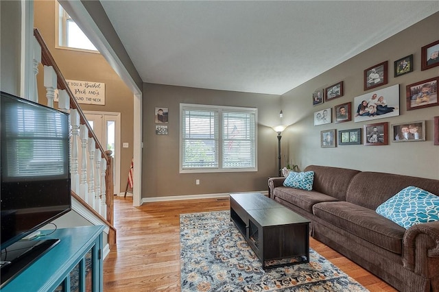 1517 Lombard Cir, South Strabane, PA 15301 - living area with stairway, light wood-type flooring, and baseboards