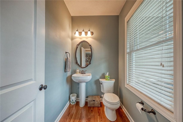 1517 Lombard Cir, South Strabane, PA 15301 - bathroom featuring toilet, wood finished floors, baseboards, and a sink