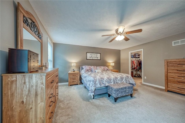 1517 Lombard Cir, South Strabane, PA 15301 - bedroom with light carpet, baseboards, a spacious closet, ceiling fan, and a closet