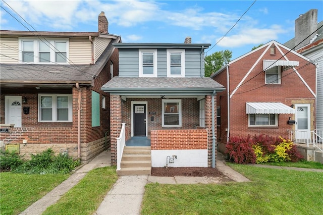 1727 Morningside Ave, Morningside, PA 15206 - view of front of house featuring brick siding, a front yard, covered porch, and a chimney