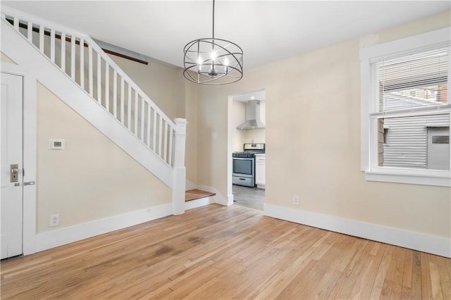 1727 Morningside Ave, Morningside, PA 15206 - empty room featuring light wood-style flooring, stairway, a chandelier, and baseboards