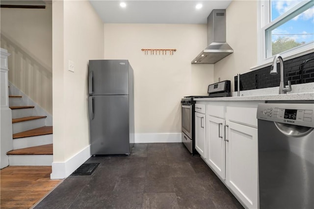 1727 Morningside Ave, Morningside, PA 15206 - kitchen with appliances with stainless steel finishes, wall chimney range hood, baseboards, decorative backsplash, and white cabinets