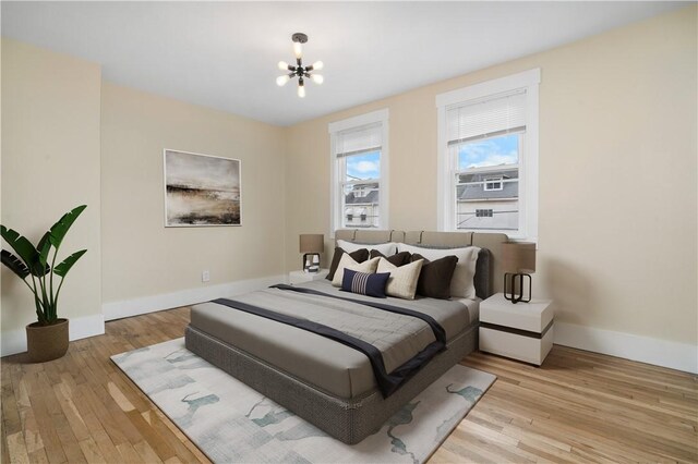 1727 Morningside Ave, Morningside, PA 15206 - bedroom with light wood finished floors, baseboards, and a chandelier