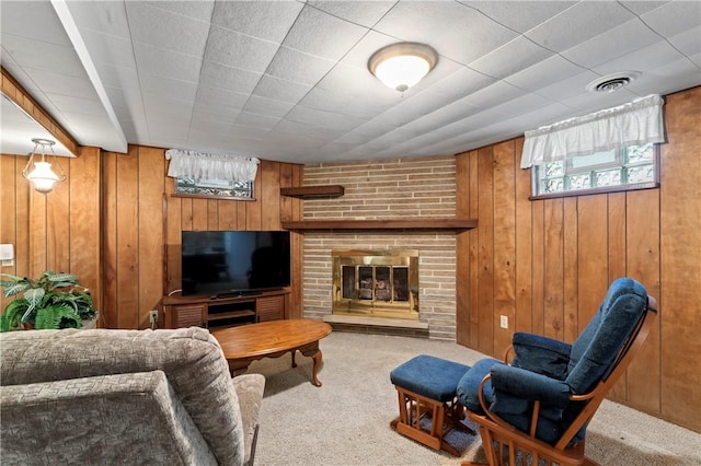 146 Samuel St, Chippewa Twp, PA 15010 - carpeted living room with wooden walls and a fireplace