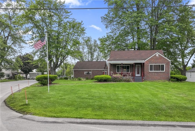 146 Samuel St, Chippewa Twp, PA 15010 - view of front of property featuring a porch, brick siding, and a front lawn