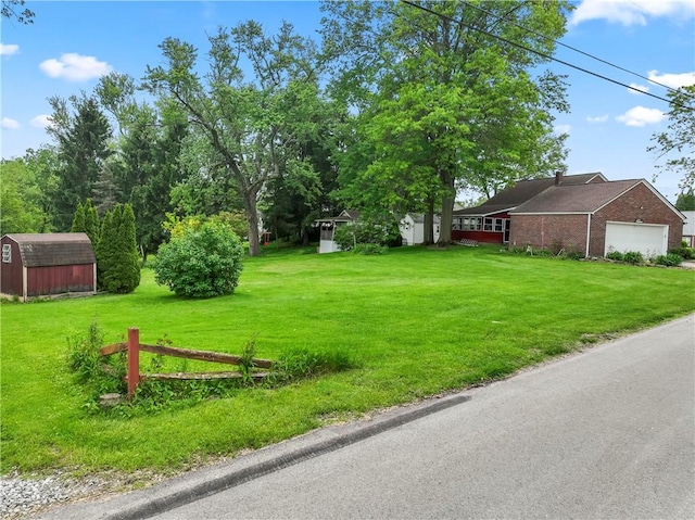 146 Samuel St, Chippewa Twp, PA 15010 - view of grassy yard with an attached garage