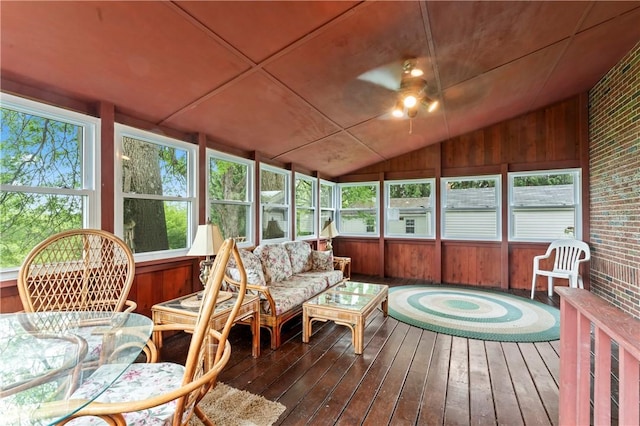 146 Samuel St, Chippewa Twp, PA 15010 - sunroom / solarium with vaulted ceiling, hardwood / wood-style floors, a deck, wooden walls, and brick wall