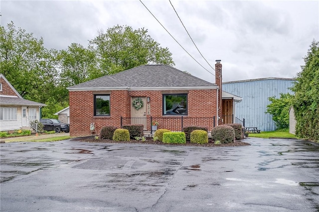 2425 W Pike St, Chartiers, PA 15342 - bungalow-style house featuring brick siding, a chimney, and a shingled roof