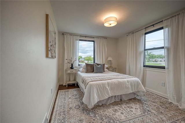 2425 W Pike St, Chartiers, PA 15342 - bedroom with multiple windows, baseboards, and wood finished floors