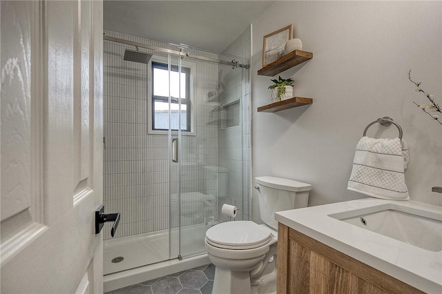 2425 W Pike St, Chartiers, PA 15342 - bathroom with a shower stall, toilet, vanity, and tile patterned floors