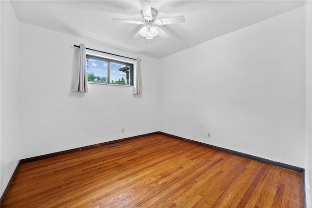 121 Edgar Ln, Peters Twp, PA 15367 - empty room with wood finished floors, a ceiling fan, and baseboards
