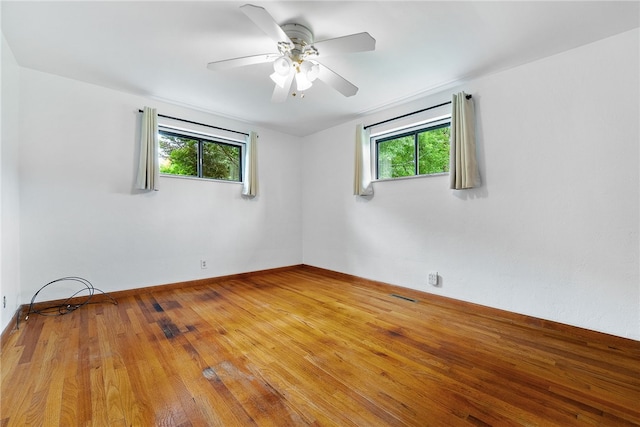 121 Edgar Ln, Peters Twp, PA 15367 - empty room with healthy amount of natural light, ceiling fan, wood finished floors, and baseboards