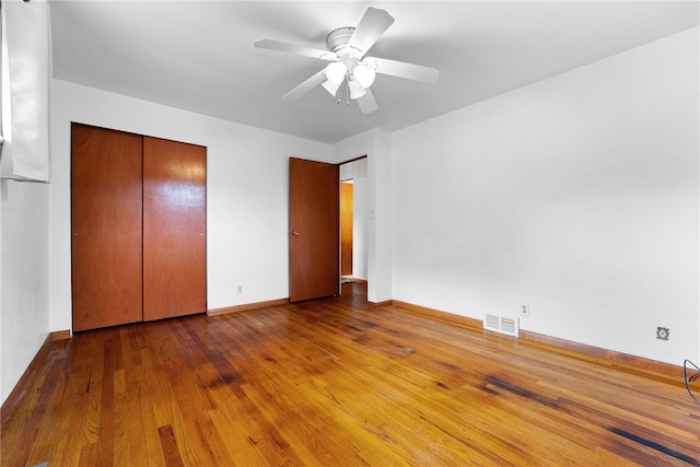 121 Edgar Ln, Peters Twp, PA 15367 - unfurnished bedroom with wood finished floors, a closet, a ceiling fan, and baseboards