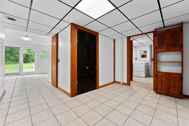 121 Edgar Ln, Peters Twp, PA 15367 - empty room featuring washer / dryer, baseboards, light tile patterned floors, and a drop ceiling