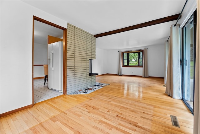 121 Edgar Ln, Peters Twp, PA 15367 - empty room with light wood-style floors, a fireplace, beamed ceiling, and baseboards
