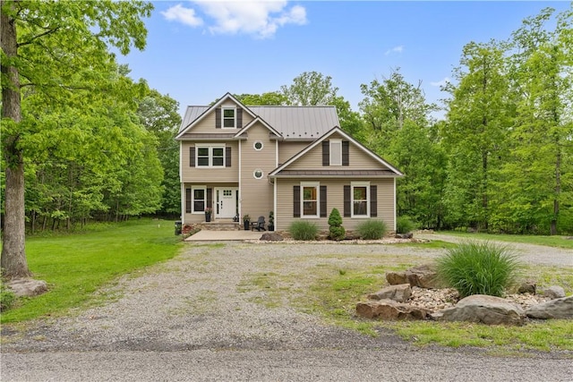 153 Bethann Rd, Bullskin Twp, PA 15610 - view of front facade featuring a front lawn, driveway, metal roof, and a standing seam roof