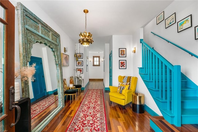 311 Derry Ridge Rd, Ligonier Twp, PA 15658 - foyer with a chandelier, wood finished floors, stairway, and arched walkways