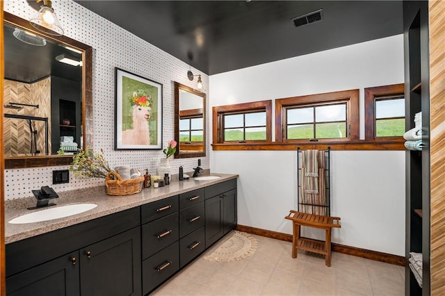 311 Derry Ridge Rd, Ligonier Twp, PA 15658 - full bathroom with double vanity, baseboards, and tasteful backsplash